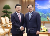 Prime Minister Pham Minh Chinh receives Lao Deputy PM, Foreign Minister